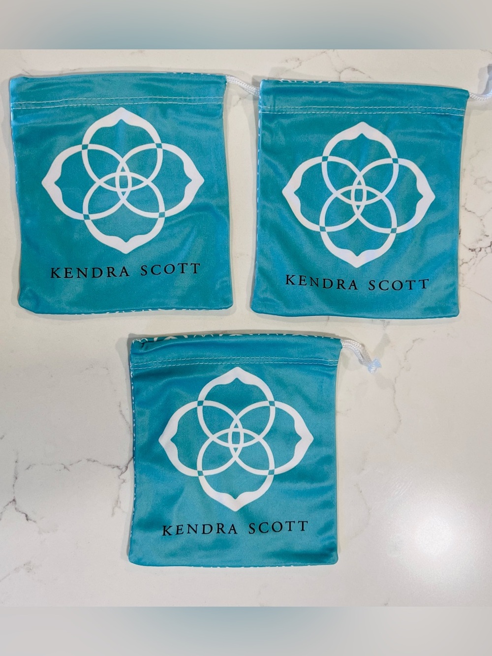 Kendra Scott Turquoise Drawstring Pouches with White Logo (Set of 3)
